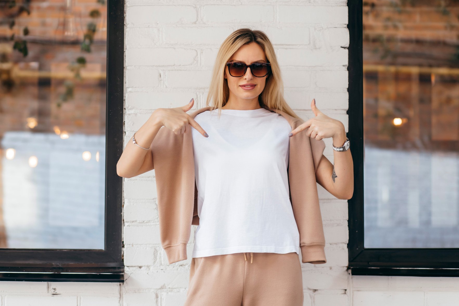 Stylish blonde girl wearing white t-shirt and glasses